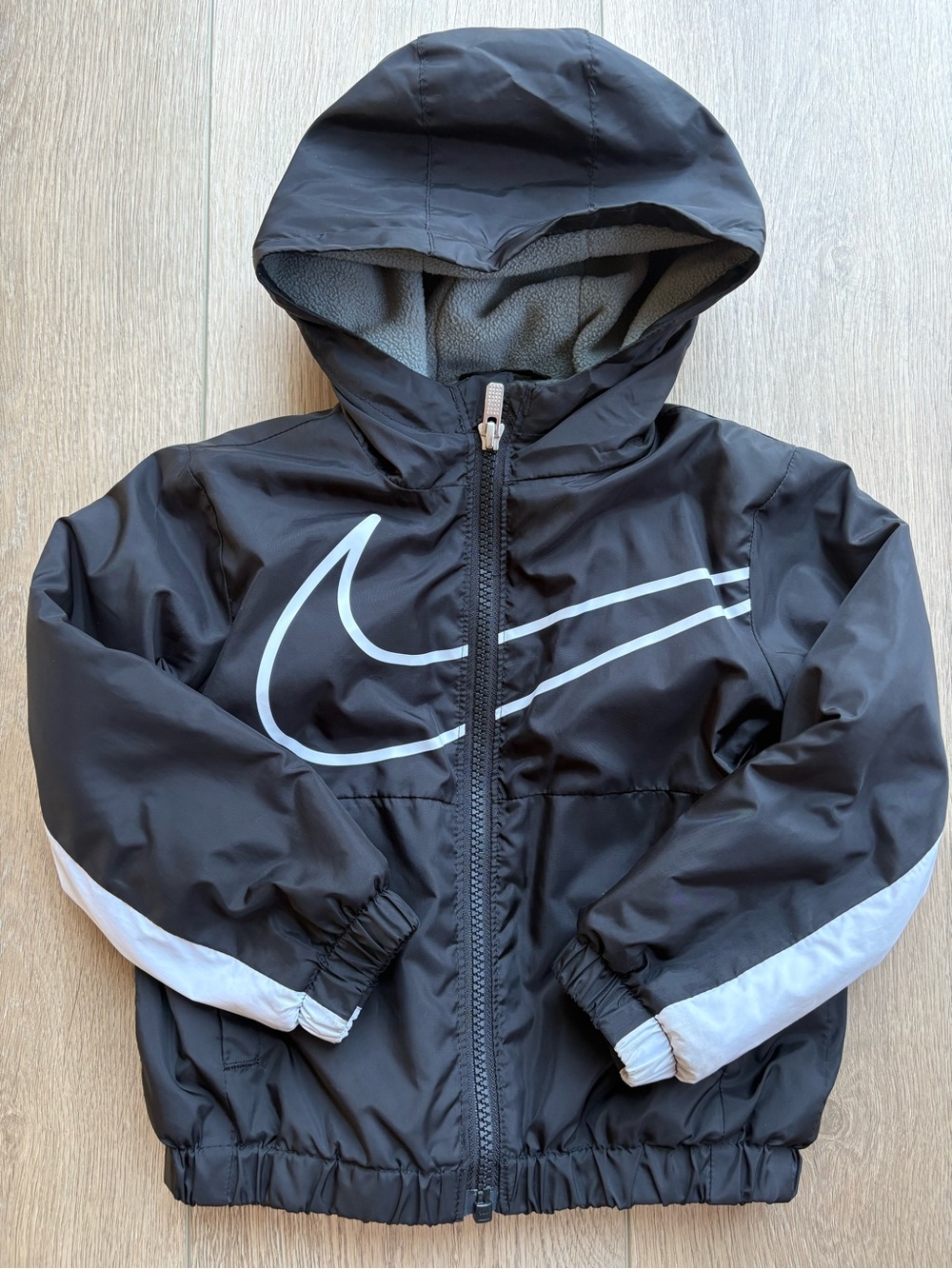 Nike Kids Black Hooded Raincoat with White Swoosh & Sleeve Stripes